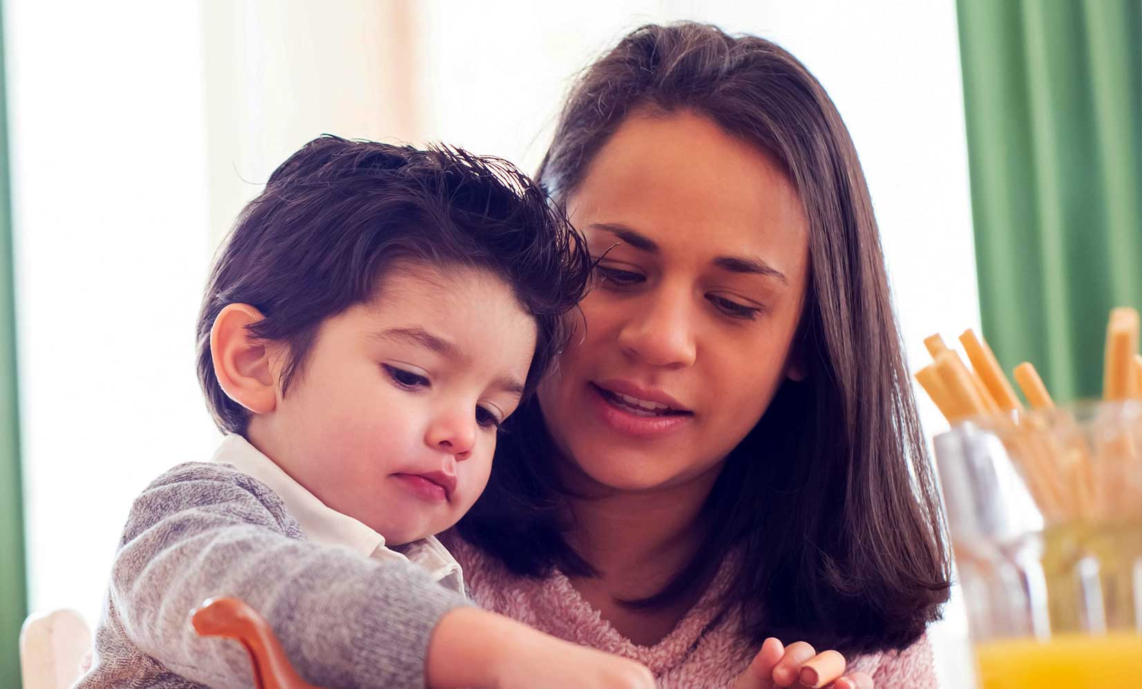 Mother and child using laptop together
